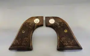 Ruger Wrangler walnut grips with laser-carved scrollwork and silver Punisher medallion