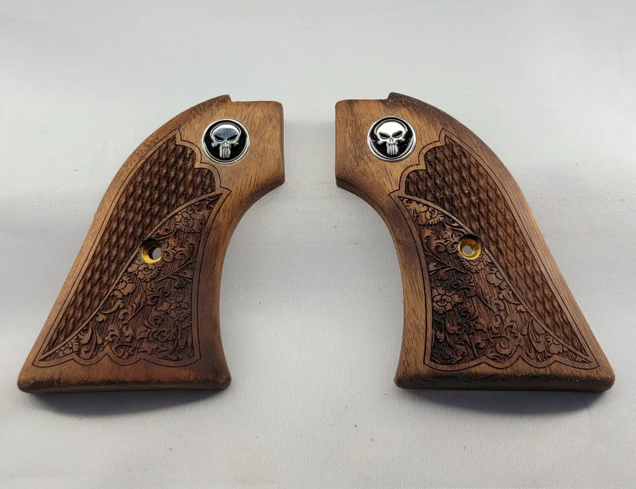 Heritage Rough Rider Black Punisher Grips — solid walnut with oakleaf checkering and Black Punisher medallion for .22 LR and .22 Magnum